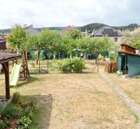 The garden of a family house in Medzibrod with a playground, greenery, and a gazebo.