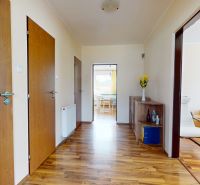 Interior of a family house with a wooden decor floor and wooden doors.