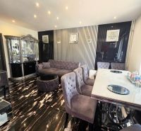 Elegant living room with marble flooring, stylish furniture, and decorations in a 4-room apartment.