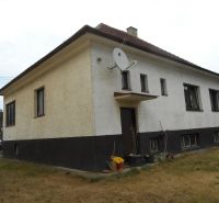 A family house in Trenčín with a simple facade and a satellite dish on the property.