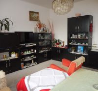 Living room in a family house with stylish furniture and decorations, a chandelier dominates the room.