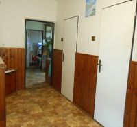 A classic hallway in a family house with a floor featuring a wooden decor pattern.