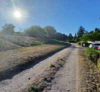 Sunny day in the village of Vojka nad Dunajom, Residential plots with access road.