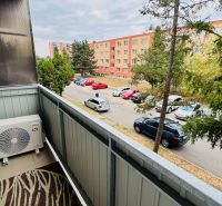Balcony with air conditioning and a view of Malá okružná street in Partizánske, at a 3-room apartment.