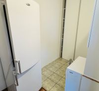 Kitchen with tiles, refrigerator, and cabinet, 3-room apartment, wooden decor flooring.