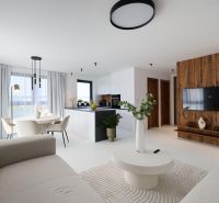 Living room in a 4-room apartment with a wooden decor floor, light furniture, and decorations.