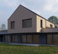 A family house in Staškov with glass doors and wooden cladding, surrounded by a lawn.