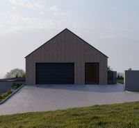 A family house in Staškov with wooden cladding and a simple roof.