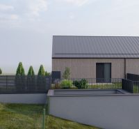 A family house in Staškov with sloping terrain and a modern fence.