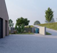A family house in Staškov with a landscaped garden, garage, and driveway.