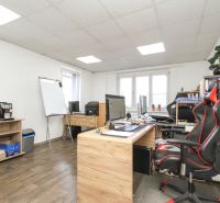 Interior of a family house with an office, wooden floor decor, white walls, office equipment.
