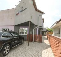 Entrance area of a family house on Kubranská Street in Trenčín with parking for cars.