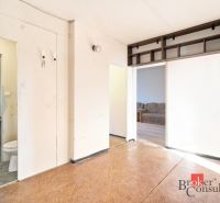 Interior with wood-patterned flooring in a 2-room apartment, view of the room.
