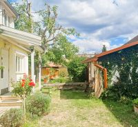 A family house in Rožňava with a garden and blooming roses in the yard.