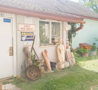 A family house in Rožňava with a separate entrance, decorated with ornaments and metal signs.