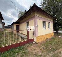 A family house in Mošovce with a colorful facade and a grass-covered plot.
