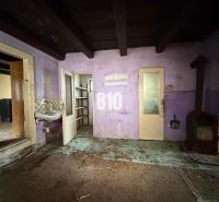 Purple walls, stove, and sink in the interior of a family house.