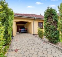 Family house on Kvetná Street in Veľké Dvorníky with a garage and a paved driveway.