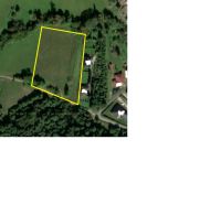 Plots - housing in Nitrianske Sučany, surrounded by greenery and trees.