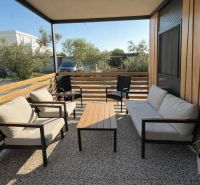 Terrace of a recreational apartment in Sukošan with comfortable furniture and greenery.