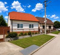 A family house on Orechova Street in Brestovany with a red roof and green lawn.