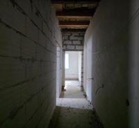 A corridor with thick walls in a family house.