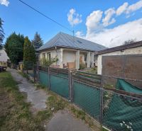 A family house in Kokšov - Bakša with a metal roof and a fenced garden.