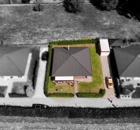 Aerial view of a family house in the town of Bytča with surrounding garden and driveway.