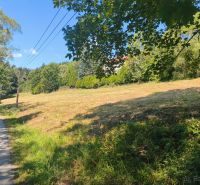 A plot for residential use on Kornica Street in Klokočov, surrounded by greenery and forests.