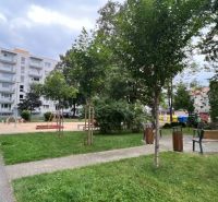 Apartment buildings with a playground on Dušana Madačova Street in Ružomberok offer peaceful living.
