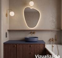 A bathroom with a designer mirror, a gold faucet, and a dark sink in a 2-room apartment.