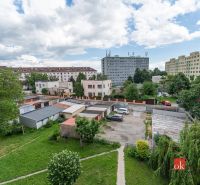 View of residential buildings and garages on Palackého Street in Košice.