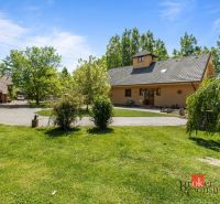 A family house in Hamuliakovo with a spacious garden and a paved driveway.