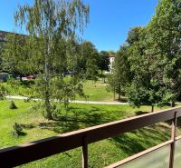 The view from the balcony of Komenský on the greenery and trees in Stará Ľubovňa.