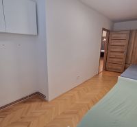 Children's room with two beds in a 3-room apartment, floor with wood decor.