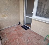 The balcony of a 3-room apartment on Pod lesom in the High Tatras contains a chair and a doormat.