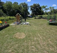 Garden on Holubyho Street in Pezinok with a children's playground and trampoline, Residential land.