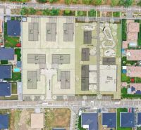 Aerial view of the planned office development at Južná Brána in Senec surrounded by houses.