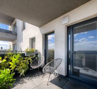 Balcony of a 4-room apartment on Zelená stráň, Košice, with plants and seating.
