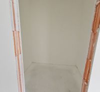 A small storage room in a 3-room apartment with white walls.