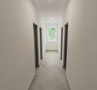 A hallway in a 3-room apartment with smooth walls and a light floor.