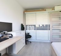 Office in a 3-room apartment with a computer, ergonomic chair, and wardrobe.
