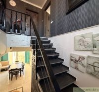 Wooden staircase and decorations in the interior of a family house.