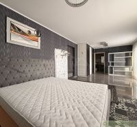 A bedroom in a family house with a striking wallpaper and a bed without a mattress.