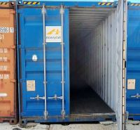 An open blue shipping container on a concrete surface in the warehouses and halls of Sokolovce.