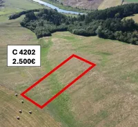 Agricultural and forest land near Plaveč with designated parcel numbers and specified price.