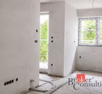Unfinished room in a 2-room apartment with white walls and wiring.