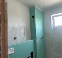 Bathroom in a 2-room apartment with ongoing installation and preparation for modifications.