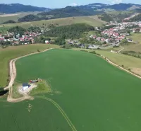 Aerial view of agricultural and forest lands in Stará Ľubovňa with picturesque landscape.