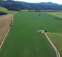 Meadows and forests in the area of Stará Ľubovňa are dominated by green agricultural lands and roads.